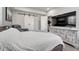 Bedroom boasts a queen-size bed, luxury vinyl plank floors, and a flat screen tv at 600 Coyote Trl, Elizabeth, CO 80107