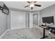 Spacious bedroom featuring a ceiling fan, closet, and an open doorway at 600 Coyote Trl, Elizabeth, CO 80107