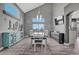 Elegant dining room with vaulted ceilings, a modern table, and stylish furnishings at 600 Coyote Trl, Elizabeth, CO 80107