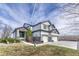 Charming two-story home with a three car garage and a well-maintained front yard at 600 Coyote Trl, Elizabeth, CO 80107