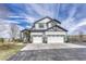 Beautiful two-story home with a three-car garage and manicured landscaping at 600 Coyote Trl, Elizabeth, CO 80107