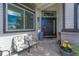 Inviting front porch featuring comfortable seating and a welcoming entrance at 600 Coyote Trl, Elizabeth, CO 80107