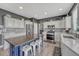 Modern kitchen features a large center island, stainless appliances and ample countertop space at 600 Coyote Trl, Elizabeth, CO 80107