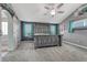Main bedroom features ceiling fan, carpet floors, and grey walls with teal curtains at 600 Coyote Trl, Elizabeth, CO 80107