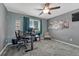 Functional home office with a large window, modern desk, and comfortable seating at 600 Coyote Trl, Elizabeth, CO 80107