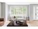 Cozy living room featuring a comfortable sofa, stylish decor, and a bright, airy feel at 1541 Glencoe St, Denver, CO 80220
