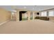 Expansive finished basement perfect for entertaining, with open layout and neutral carpet at 6783 E Orchard Rd, Greenwood Village, CO 80111