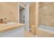 Bathroom featuring a tiled shower, tiled floors and stone countertops at 6783 E Orchard Rd, Greenwood Village, CO 80111