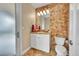 Beautiful bathroom featuring a vanity with tiled backsplash, and modern lighting at 6783 E Orchard Rd, Greenwood Village, CO 80111