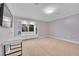 Cozy bedroom with carpet, built-in shelves, and lots of natural light at 6783 E Orchard Rd, Greenwood Village, CO 80111