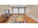 Spacious bedroom with an alphabet rug and lots of natural light at 6783 E Orchard Rd, Greenwood Village, CO 80111