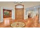 Grand foyer with hardwood floors, decorative medallion, and a view of the dining spaces at 6783 E Orchard Rd, Greenwood Village, CO 80111
