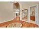Elegant foyer with hardwood floors, decorative medallion, and a view of the living spaces at 6783 E Orchard Rd, Greenwood Village, CO 80111