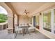 Covered patio with comfortable seating, ceiling fan, and easy access to the indoors at 6783 E Orchard Rd, Greenwood Village, CO 80111