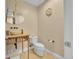 Cozy powder room featuring a unique vessel sink, modern fixtures, and stylish decor at 6783 E Orchard Rd, Greenwood Village, CO 80111