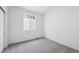 Bright bedroom featuring a large window and neutral carpeting provides a calm and inviting space at 1242 Penner Dr, Erie, CO 80026