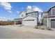 New two-story home featuring a two-car garage and portico at 1242 Penner Dr, Erie, CO 80026
