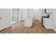 Modern kitchen boasts white cabinetry, a center island, and stainless steel appliances at 1242 Penner Dr, Erie, CO 80026
