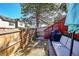 Cozy fenced backyard with a patio set and mature tree, perfect for relaxing and entertaining outdoors at 18273 E Arizona Ave # D, Aurora, CO 80017