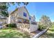 Exterior view of home featuring a fenced yard, deck, and well-maintained landscaping at 18273 E Arizona Ave # D, Aurora, CO 80017