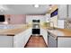 Bright kitchen with butcher block countertops and stainless steel appliances at 18273 E Arizona Ave # D, Aurora, CO 80017
