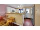 Bright kitchen with white cabinets, modern appliances, and a dining area nearby at 18273 E Arizona Ave # D, Aurora, CO 80017