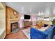 Stylish living room with a fireplace, modern decor, and an open concept design at 18273 E Arizona Ave # D, Aurora, CO 80017
