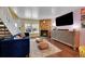 Cozy living room featuring a fireplace, large windows, and comfortable seating at 18273 E Arizona Ave # D, Aurora, CO 80017