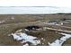 Panoramic aerial view of new home and lot in a pastoral setting with scattered snow at 5424 Freddys Trl, Parker, CO 80134