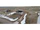Beautiful new home on a large lot featuring surrounding meadows with scattered snow and distant homes at 5424 Freddys Trl, Parker, CO 80134
