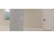 Spacious basement features neutral color palette, carpet, and a structural column at 5424 Freddys Trl, Parker, CO 80134