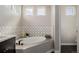Bright bathroom features a soaking tub and a decorative tile backsplash at 5424 Freddys Trl, Parker, CO 80134