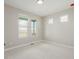 Bright bedroom featuring light carpet and multiple windows providing plenty of natural light at 5424 Freddys Trl, Parker, CO 80134