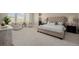 Bright bedroom features a tufted headboard, seating area, and large windows providing natural light and views at 5424 Freddys Trl, Parker, CO 80134