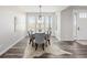 Stylish dining room with table and chairs, bright lighting, and scenic outdoor views at 5424 Freddys Trl, Parker, CO 80134