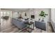 Inviting living room with a fireplace, comfortable seating, and lots of natural light at 5424 Freddys Trl, Parker, CO 80134