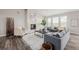 Cozy living room with a fireplace, neutral decor, and large windows offering scenic views at 5424 Freddys Trl, Parker, CO 80134