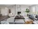 Comfortable living room features a fireplace, neutral walls, modern decor, and scenic views at 5424 Freddys Trl, Parker, CO 80134