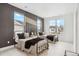 Spacious bedroom with twin beds, large windows, and modern accents at 6263 E 142Nd Pl, Thornton, CO 80602