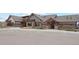 Beautiful clubhouse with stone and siding facade and ample parking at 6263 E 142Nd Pl, Thornton, CO 80602