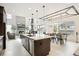 Open concept living with a modern kitchen, adjacent to dining and living spaces, perfect for entertaining at 6263 E 142Nd Pl, Thornton, CO 80602