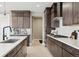 Well-equipped kitchen with stainless steel appliances, spacious countertops, and modern finishes at 6263 E 142Nd Pl, Thornton, CO 80602