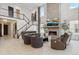 Bright living room with soaring ceilings, fireplace, sleek furniture, and stylish decor creates a welcoming space at 6263 E 142Nd Pl, Thornton, CO 80602