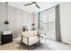 Bright office with a modern accent wall, lots of natural light and comfortable furniture at 6263 E 142Nd Pl, Thornton, CO 80602