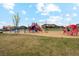 Community playground featuring modern play structures, a covered picnic area, and well-maintained landscaping at 6263 E 142Nd Pl, Thornton, CO 80602