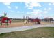 Community playground with slides, swings and plenty of room to play at 6263 E 142Nd Pl, Thornton, CO 80602