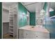 Retro bathroom with custom lighting, unique fixtures, and adjacent closet at 3131 E Alameda Ave # 1203, Denver, CO 80209