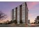 Striking view of the building's facade, showcasing the architectural design and surrounding landscape at 3131 E Alameda Ave # 1203, Denver, CO 80209