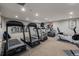 Well-equipped fitness room with modern exercise machines and mirrored walls at 3131 E Alameda Ave # 1203, Denver, CO 80209