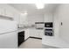 Well-maintained kitchen with classic white appliances and ample cabinet space at 3131 E Alameda Ave # 1203, Denver, CO 80209